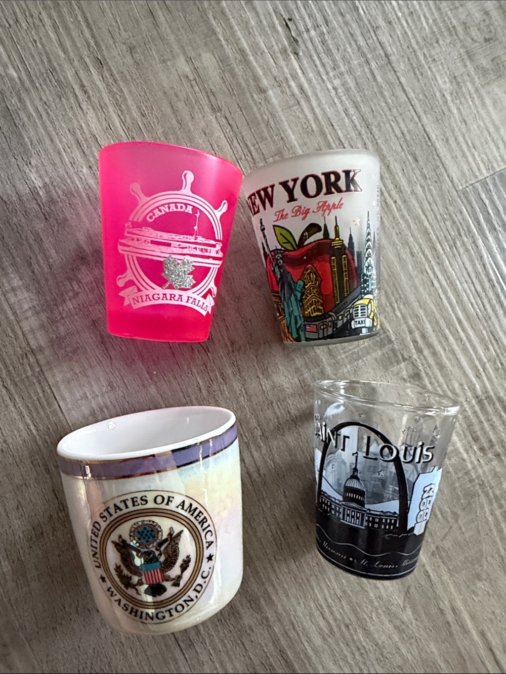Set of four united states and canada shot glasses